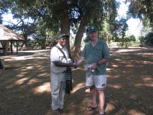 Frank Mabasa receives a RFCG cap, coffee mug and T shirt from Eelco Meyjes in appreciation for his valuable services as a bird guide